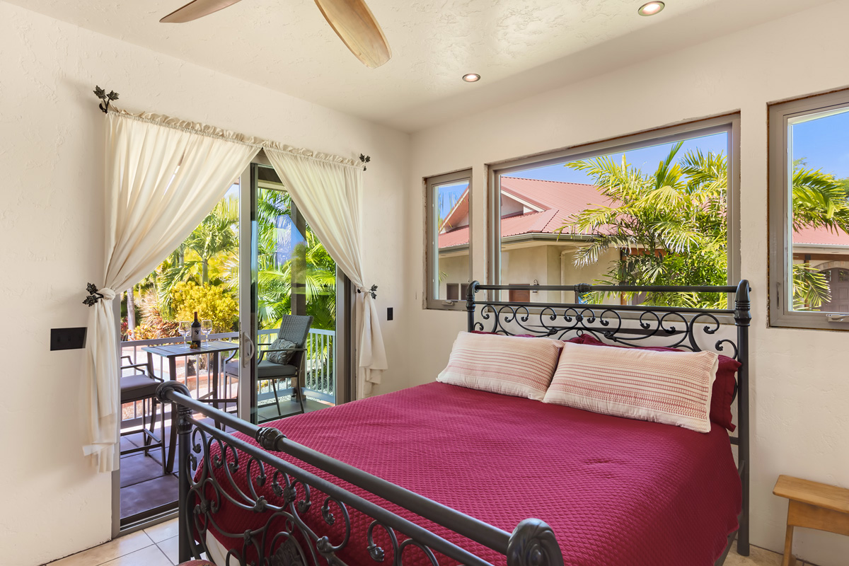 13-308 Kamaili Road Pahoa, HI 96778 - Photo 17 of 29 a bedroom with a bed and large windows
