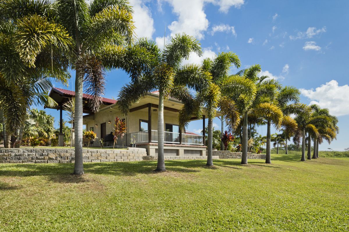 13-308 Kamaili Road Pahoa, HI 96778 - Photo 21 of 29 a view of a fountain in front of a house with a big yard