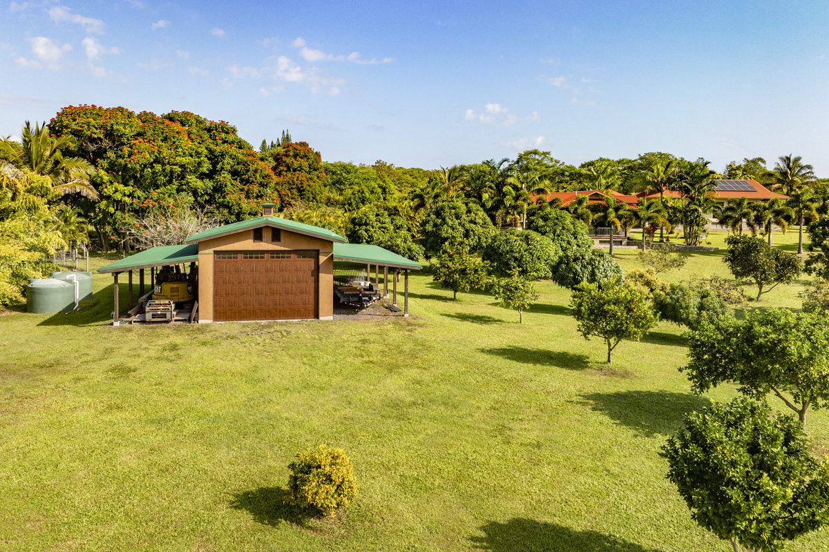 13-308 Kamaili Road Pahoa, HI 96778 - Photo 28 of 29 a swimming pool with trees in the background