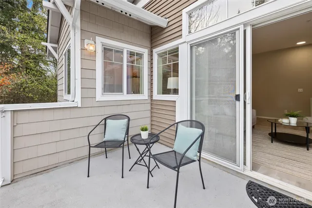a view of a chair and table in the balcony