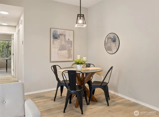 a view of a dining room with furniture and wooden floor