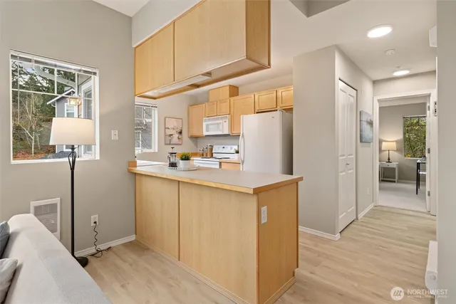 a kitchen with stainless steel appliances a refrigerator and a stove