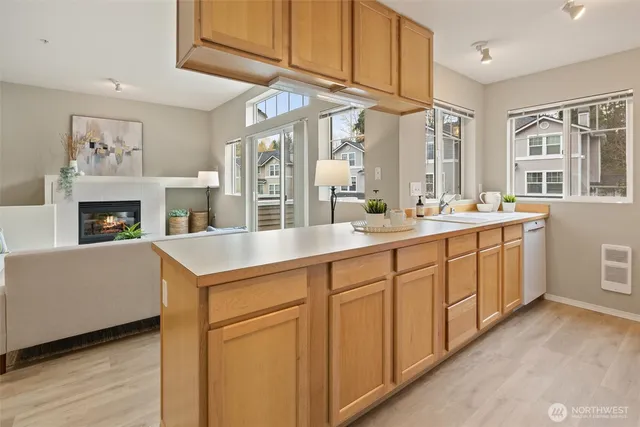 a spacious en suite bathroom with a sink and a mirror