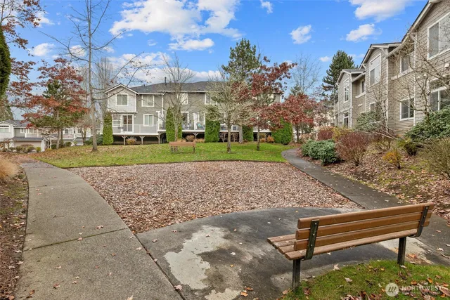 a view of a bench in a park