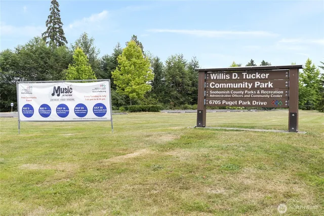 a view of a backyard with swimming pool