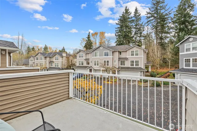 a view of a white building with a city view