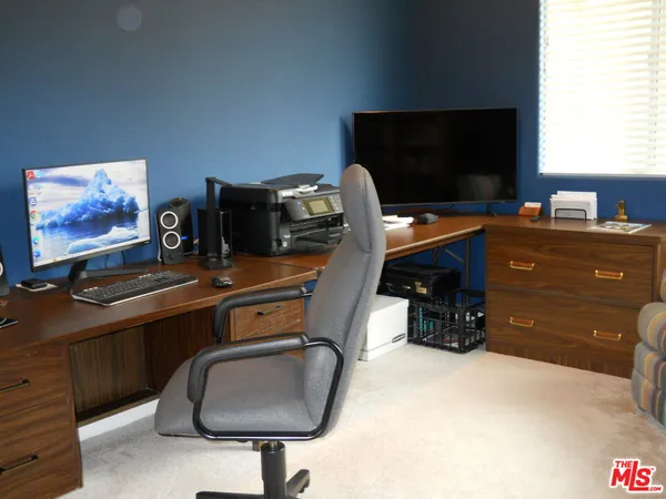 a room with furniture and flat screen tv