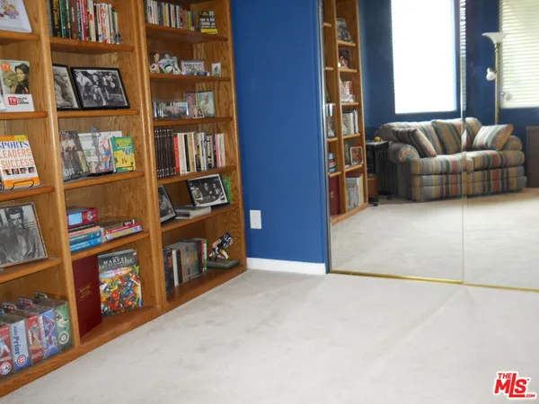 a view of an empty room with shelves
