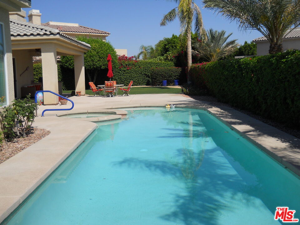 6 Thatcher Court Rancho Mirage, CA 92270 - Photo 22 of 25 a view of a house with a swimming pool