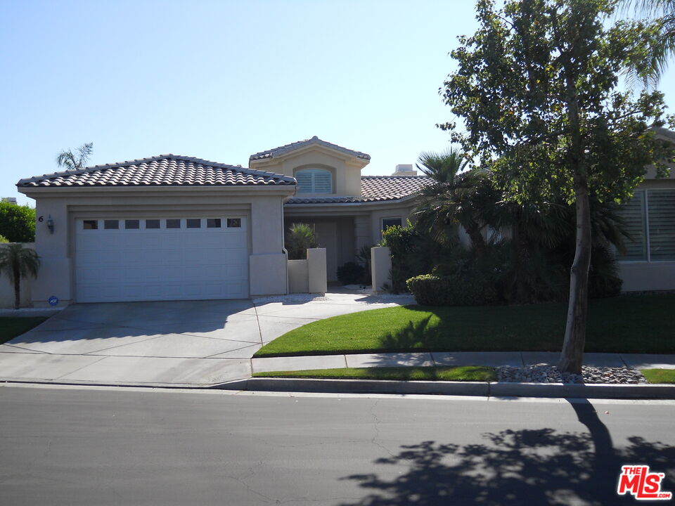 6 Thatcher Court Rancho Mirage, CA 92270 - Photo 6 of 25 a front view of a house with garden