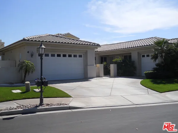 a house with a yard and a garage