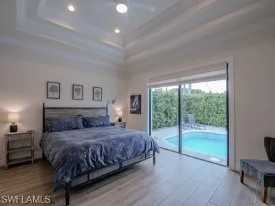 a bathroom with a tub a sink and mirror