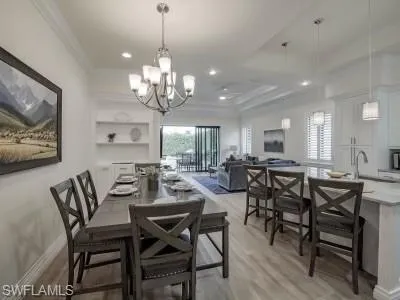 a living room with furniture and a painting on the wall