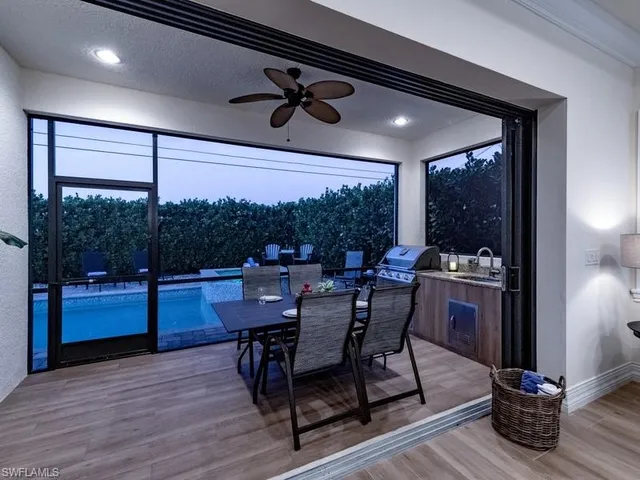 a view of a dining room with furniture window and outside view