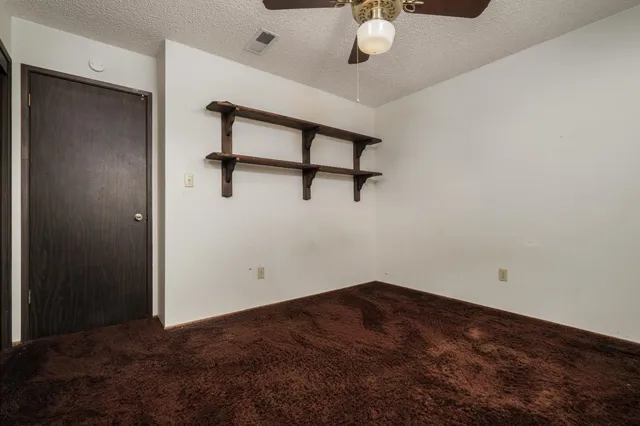 a view of a room with a hanging light