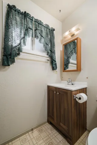 a bathroom with a sink and mirror