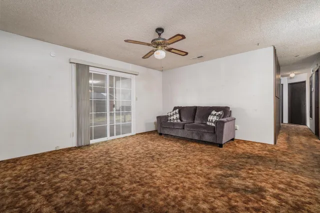 a living room with furniture and window