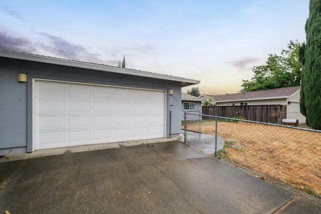 a front view of a house with garage