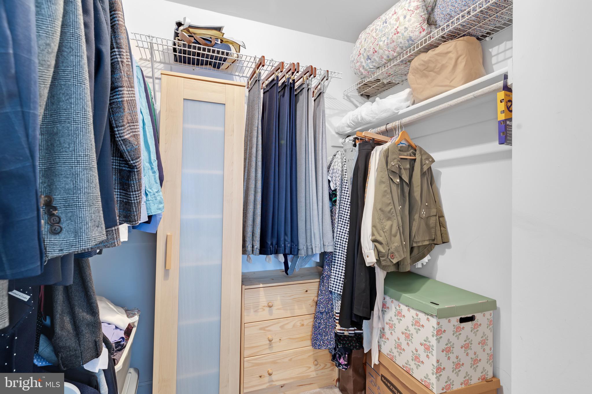 8110 Squirrel Run Road Springfield, VA 22152 - Photo 23 of 53 a view of walk in closet with clothes and shoes