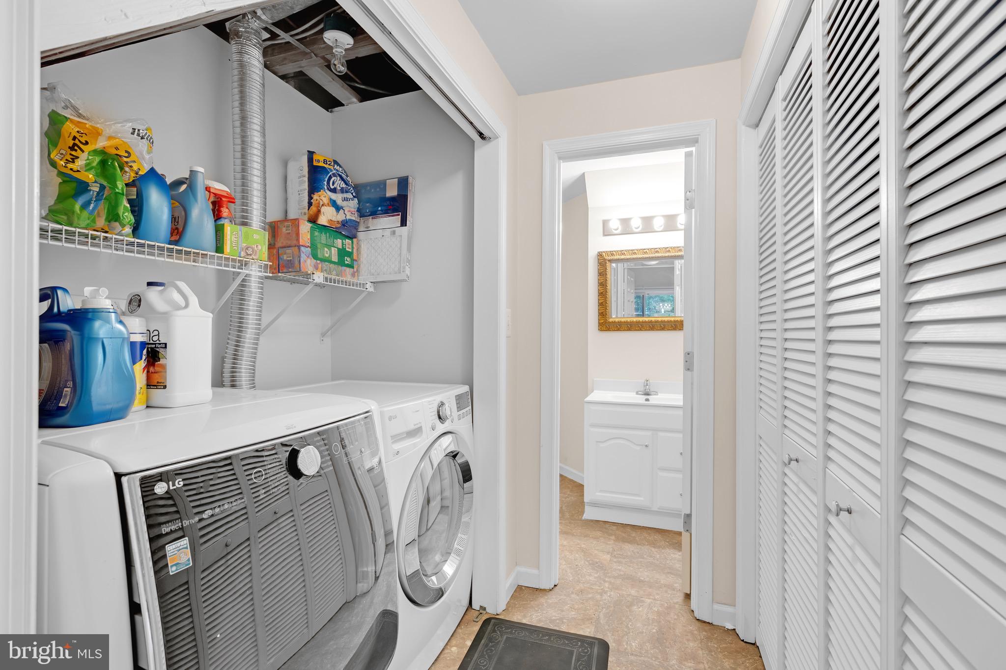 8110 Squirrel Run Road Springfield, VA 22152 - Photo 36 of 53 a storage room with washer and dryer