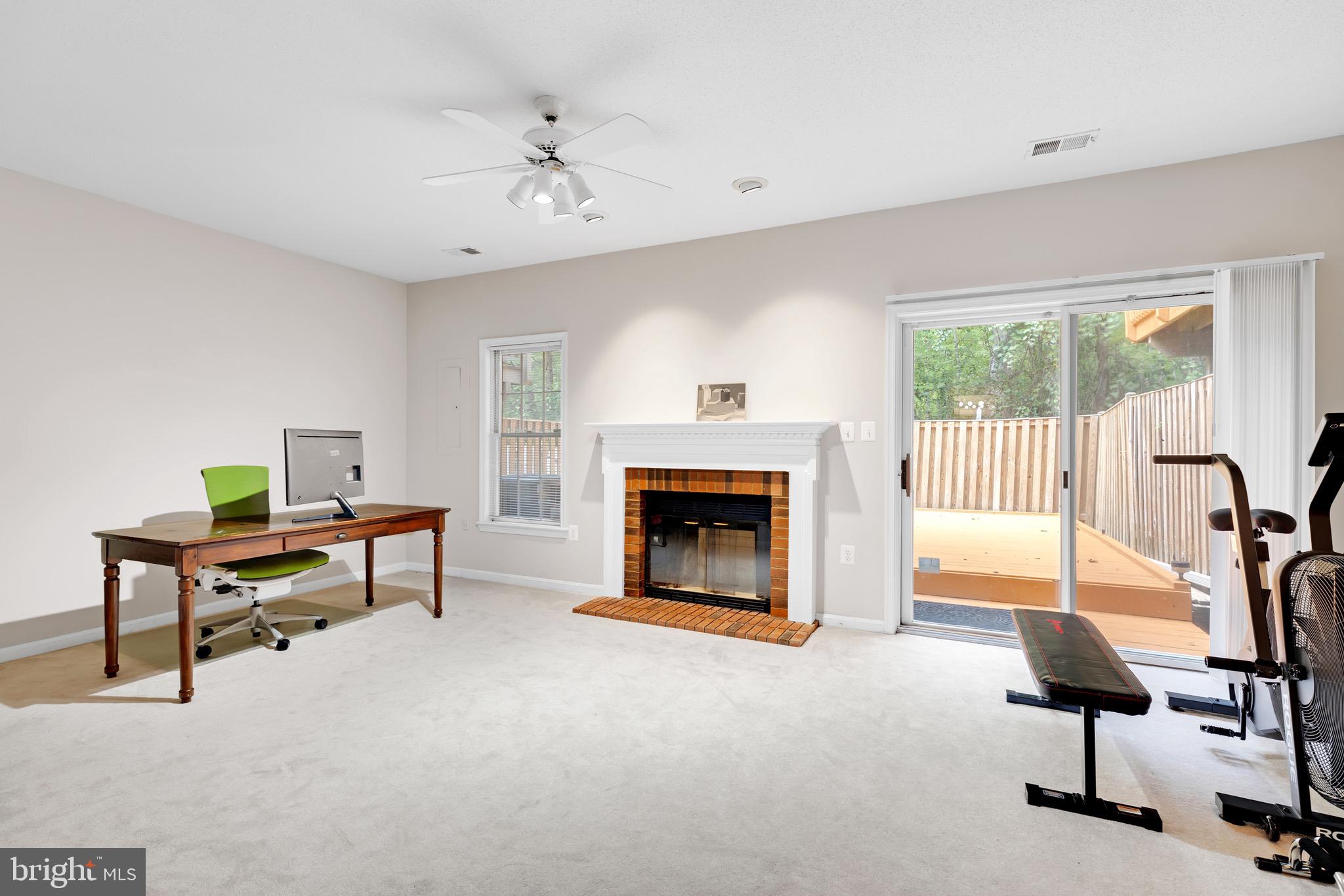 8110 Squirrel Run Road Springfield, VA 22152 - Photo 39 of 53 a living room with furniture and a fireplace