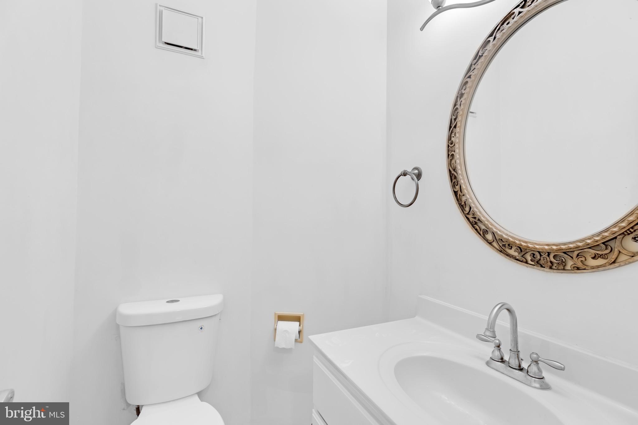 8110 Squirrel Run Road Springfield, VA 22152 - Photo 9 of 53 a bathroom with a sink and a mirror