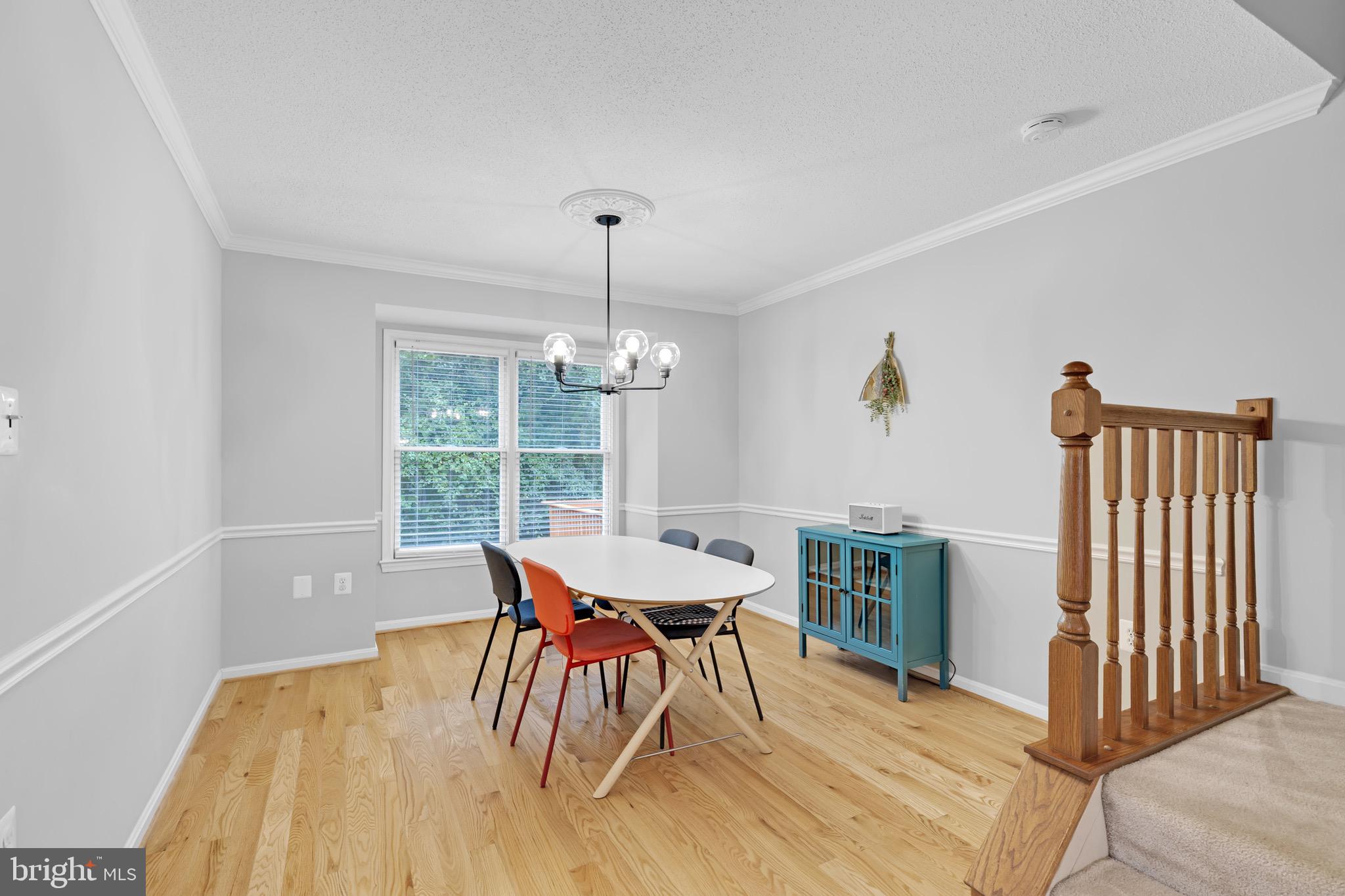 8110 Squirrel Run Road Springfield, VA 22152 - Photo 10 of 53 a view of a dining room with furniture window and wooden floor