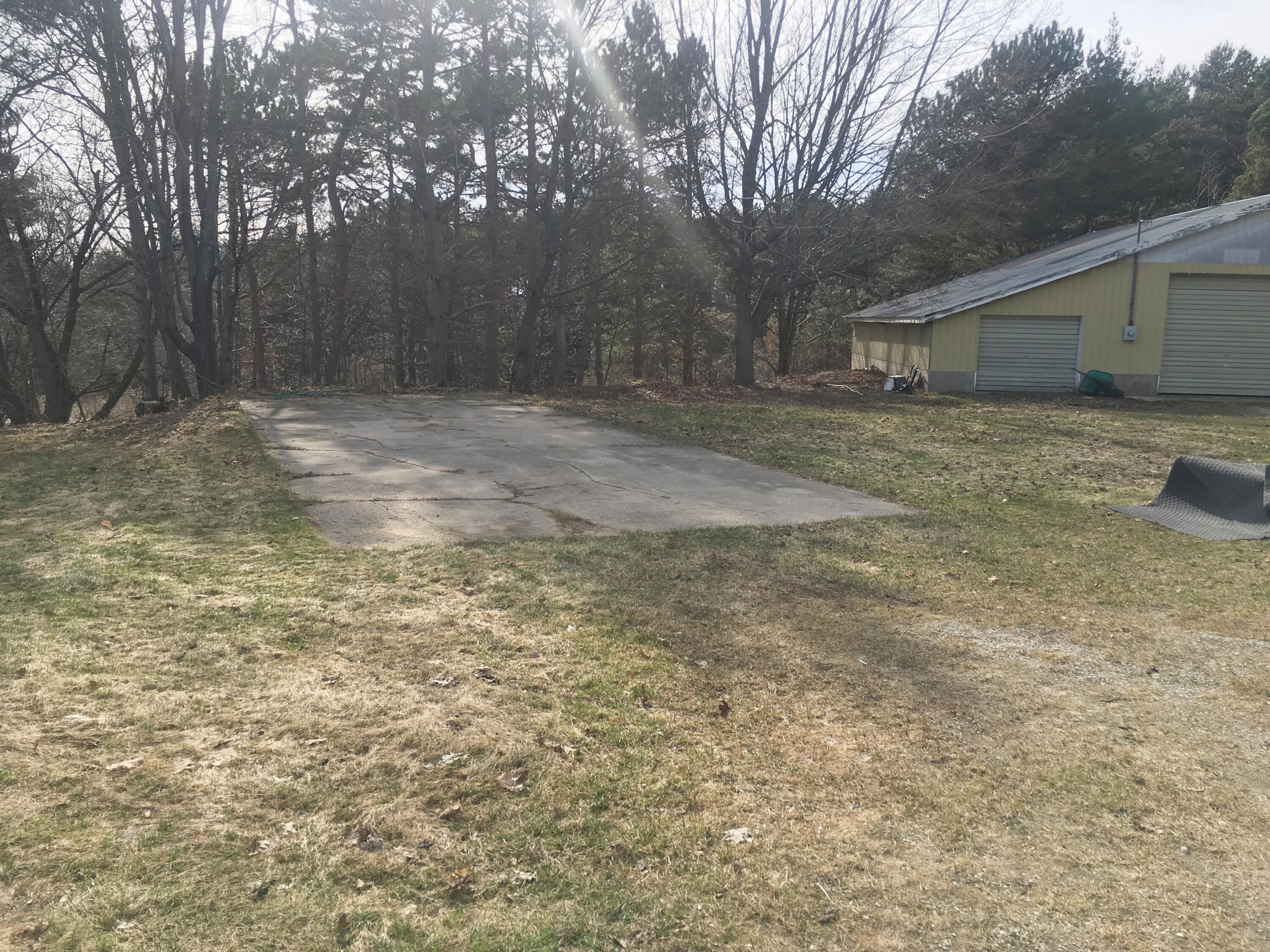 9188 Erdman Road Onekama, MI 49675 - Photo 3 of 33 RV pad and pole barn