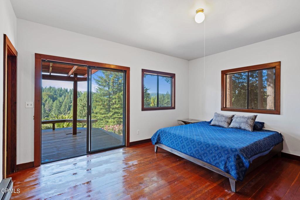 19200 Tramway Navarro, CA 95463 - Photo 20 of 50 a bedroom with a bed and a large window