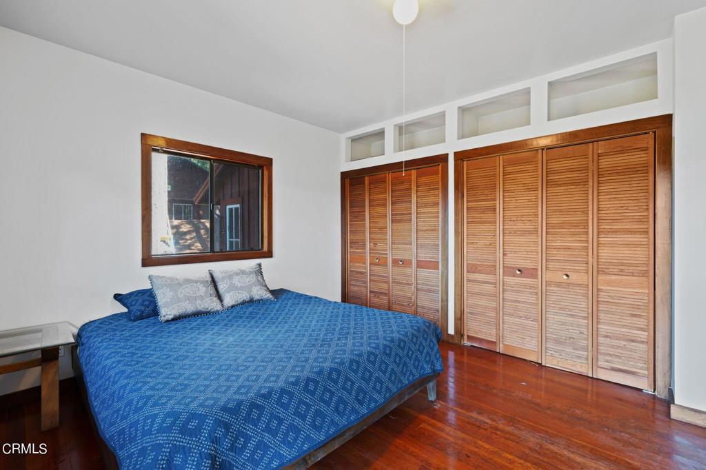 19200 Tramway Navarro, CA 95463 - Photo 21 of 50 a bedroom with a large bed and wooden floor