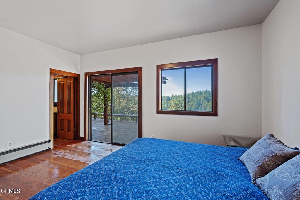 19200 Tramway Navarro, CA 95463 - Photo 22 of 50 a bedroom with a bed and wooden floor