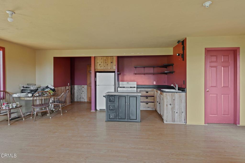 19200 Tramway Navarro, CA 95463 - Photo 37 of 50 a kitchen with stainless steel appliances a refrigerator and wooden cabinets