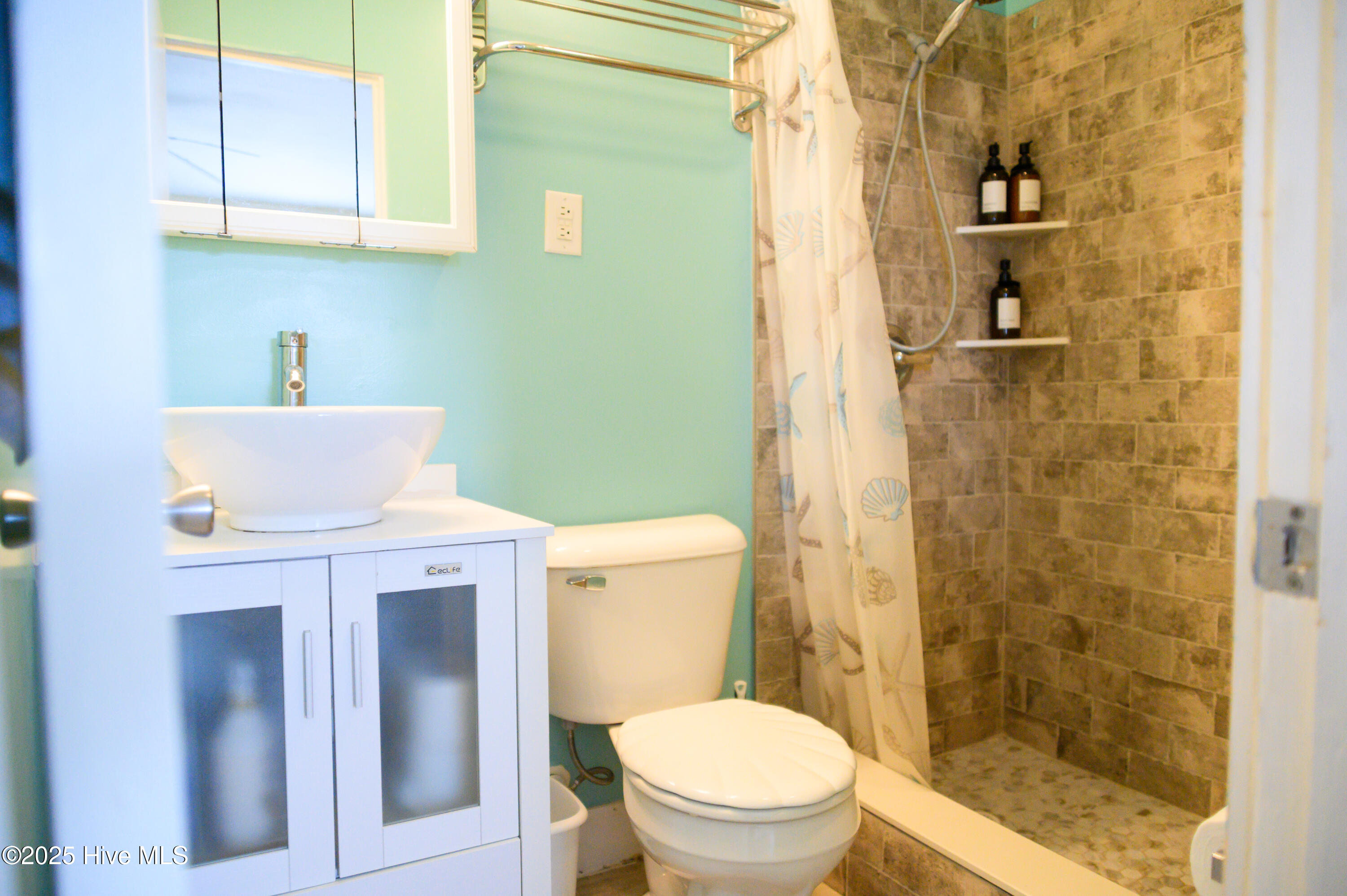 201 Henderson Boulevard, Unit 1 Atlantic Beach, NC 28512 - Photo 3 of 14 Full Bathroom with Natural Stone Tile Walk-In Shower