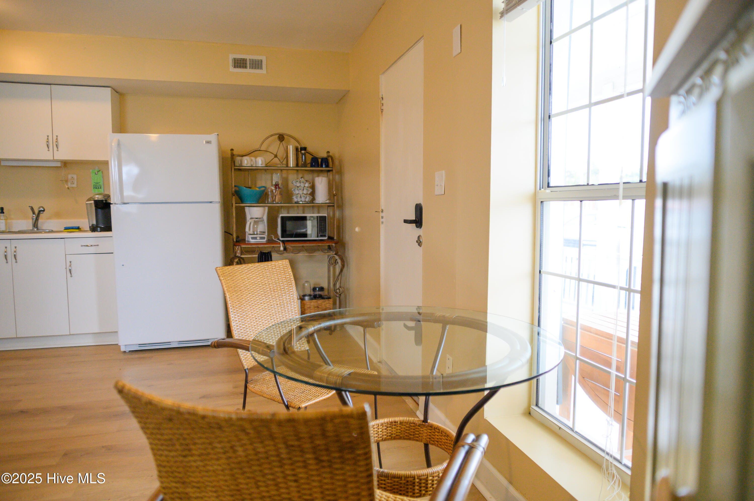 201 Henderson Boulevard, Unit 1 Atlantic Beach, NC 28512 - Photo 8 of 14 Bistro-Style Dining Seating for Two