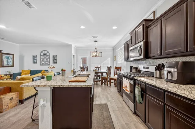 a living room with furniture flat screen tv and a fireplace
