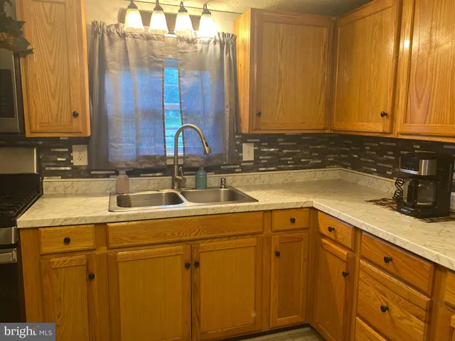 a kitchen with a sink and cabinets