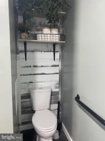 a view of a hallway with entryway door