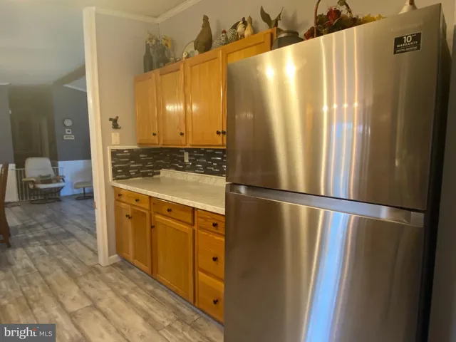 a view of a kitchen from the hallway