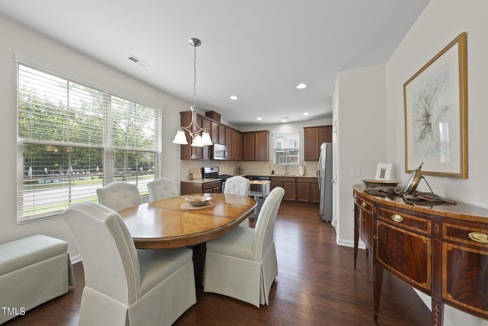 2 Intuition Circle Durham, NC 27705 - Photo 13 of 33 a dining room with furniture a chandelier and wooden floor