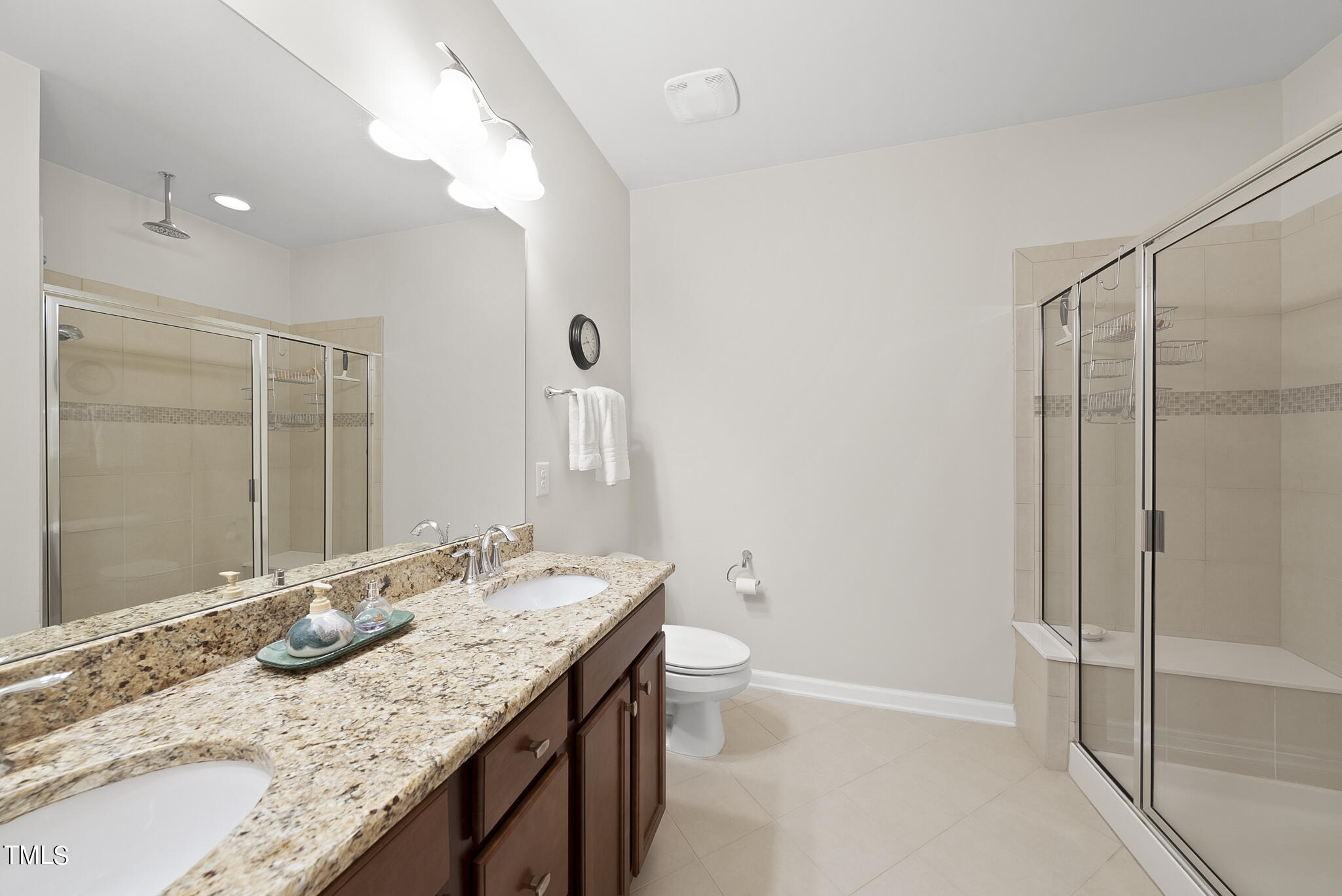 2 Intuition Circle Durham, NC 27705 - Photo 22 of 33 a bathroom with a granite countertop sink a toilet and shower