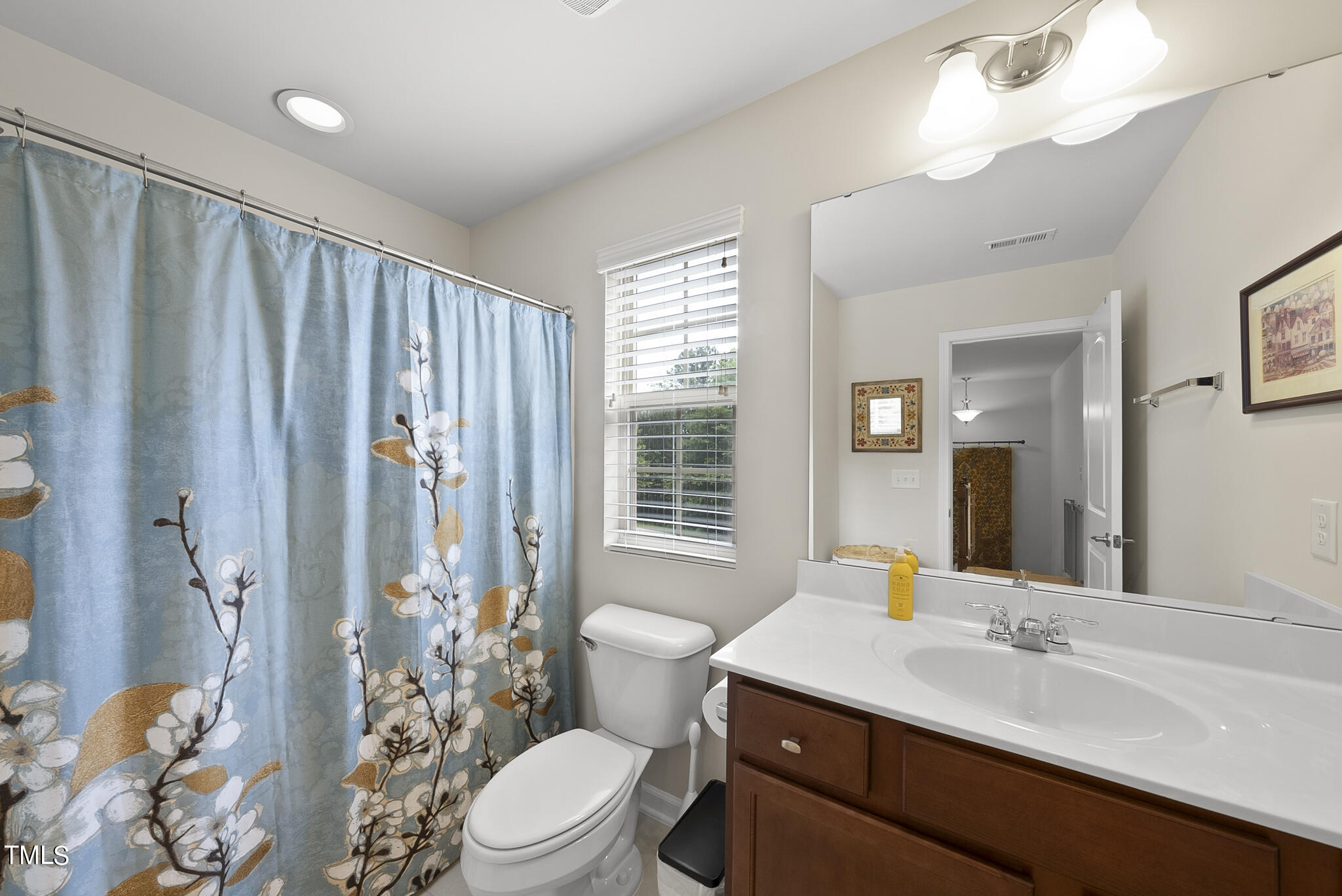 2 Intuition Circle Durham, NC 27705 - Photo 27 of 33 a bathroom with a sink a toilet a mirror and shower