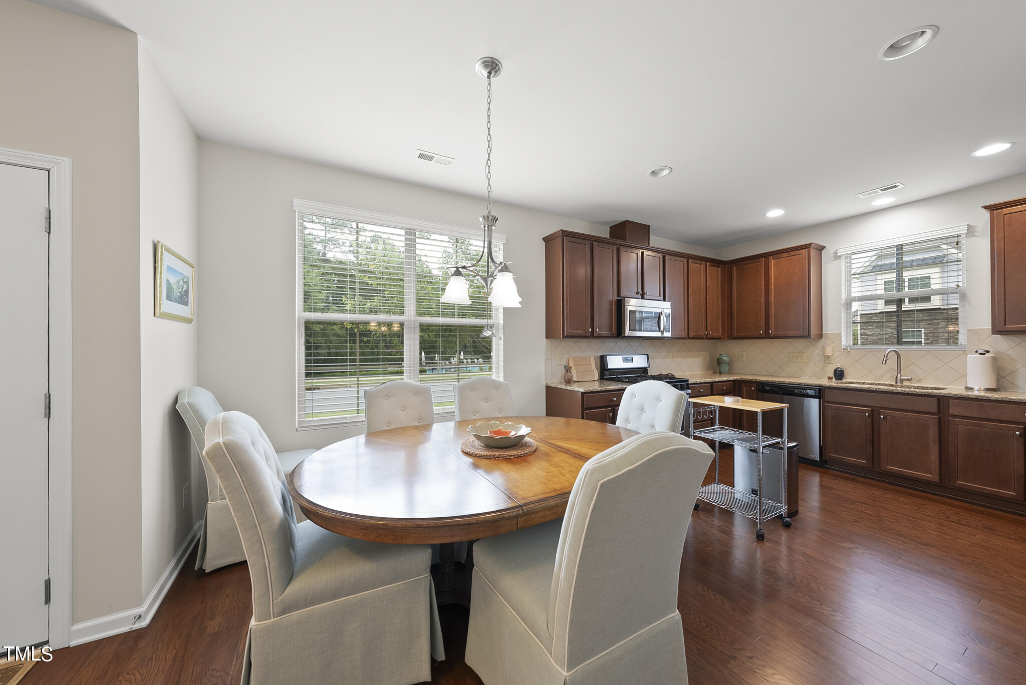 2 Intuition Circle Durham, NC 27705 - Photo 5 of 33 a view of a dining room with furniture window and wooden floor