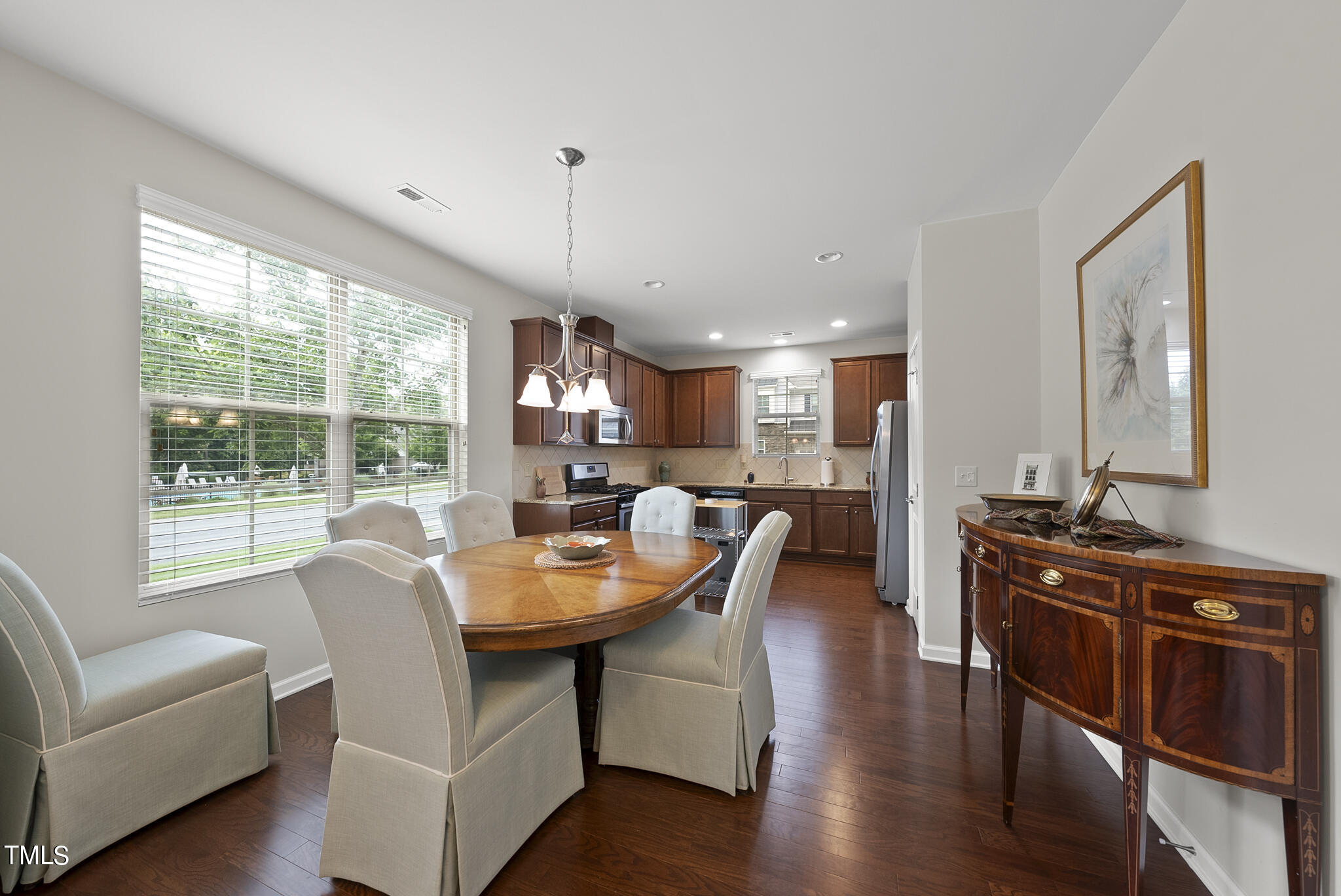 2 Intuition Circle Durham, NC 27705 - Photo 7 of 33 a view of a dining room with furniture window and wooden floor