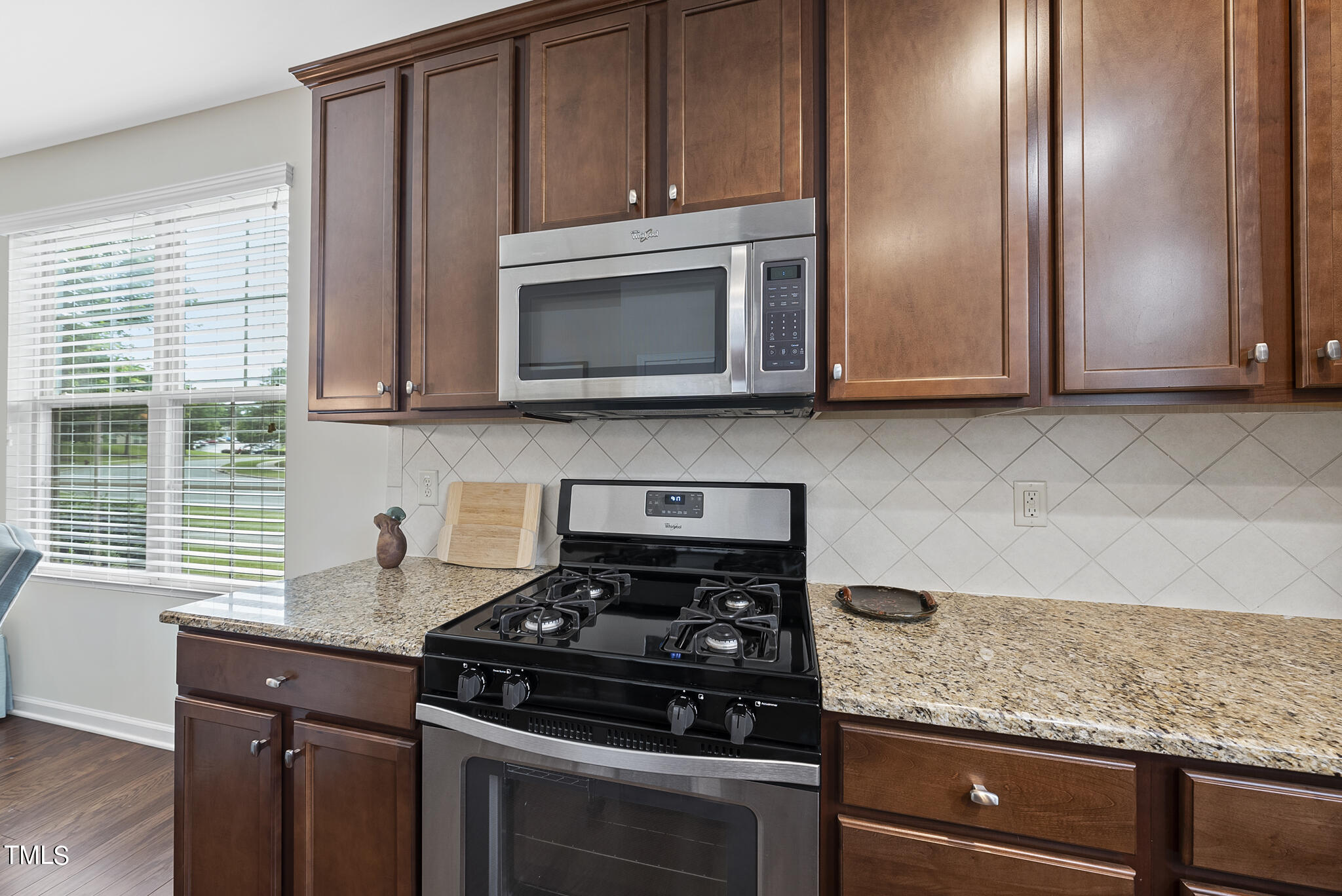 2 Intuition Circle Durham, NC 27705 - Photo 10 of 33 a kitchen with granite countertop cabinets stainless steel appliances and a window