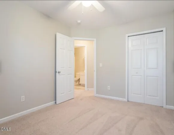 an empty room with closet area