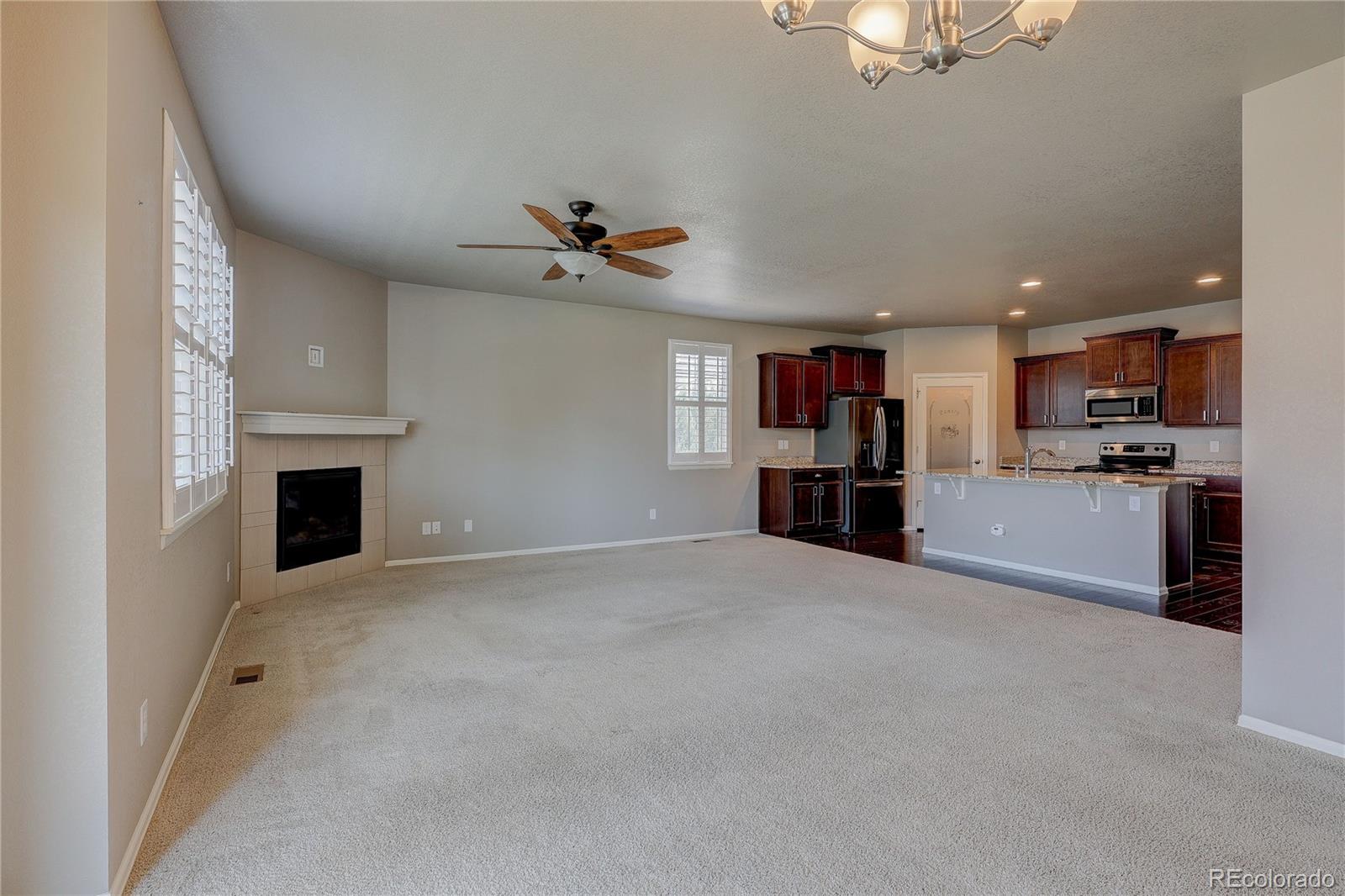 8891 Foxfire Street Firestone, CO 80504 - Photo 17 of 37 a view of a kitchen with furniture and a kitchen