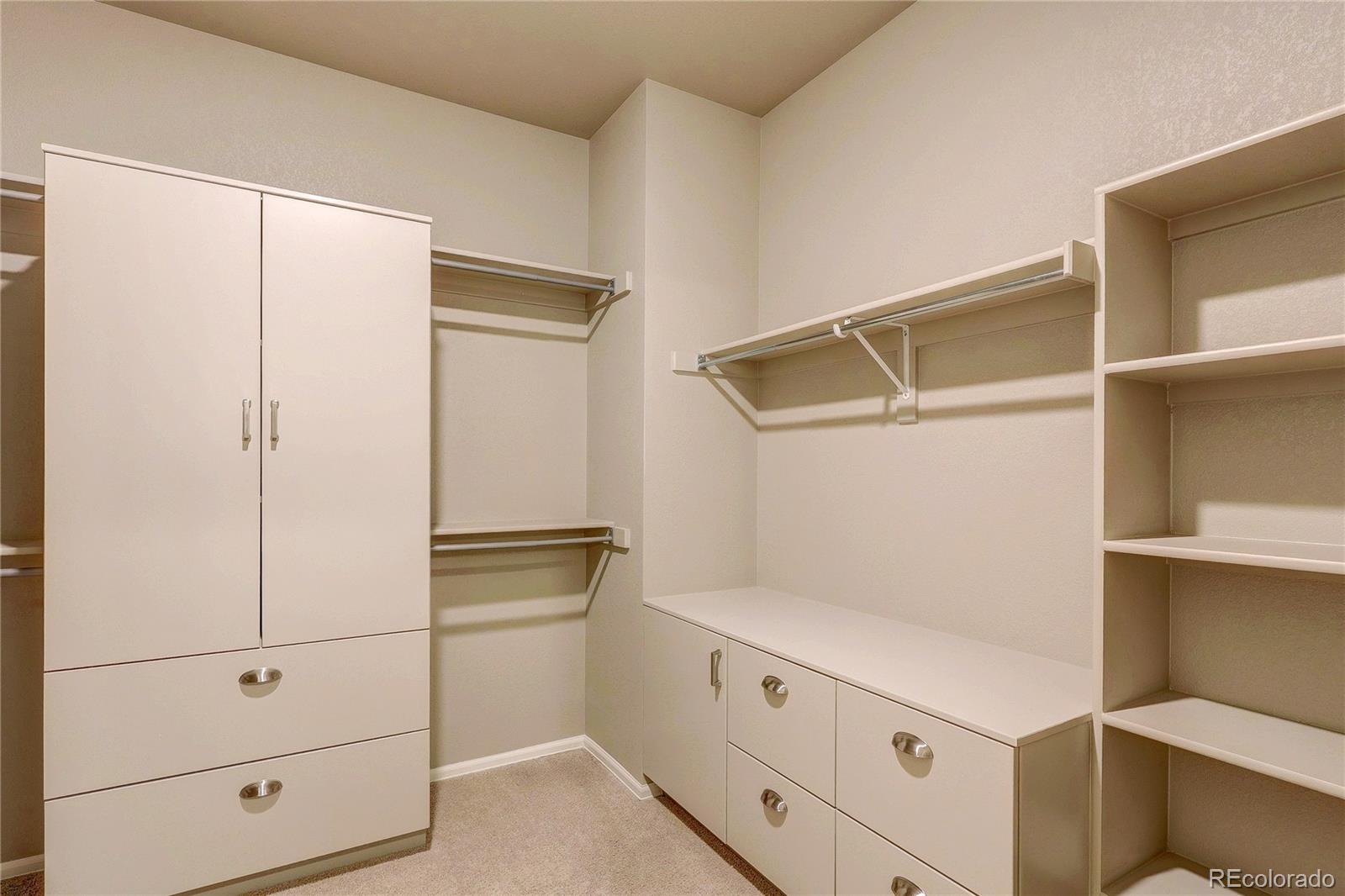 8891 Foxfire Street Firestone, CO 80504 - Photo 26 of 37 a kitchen with white cabinets and white appliances