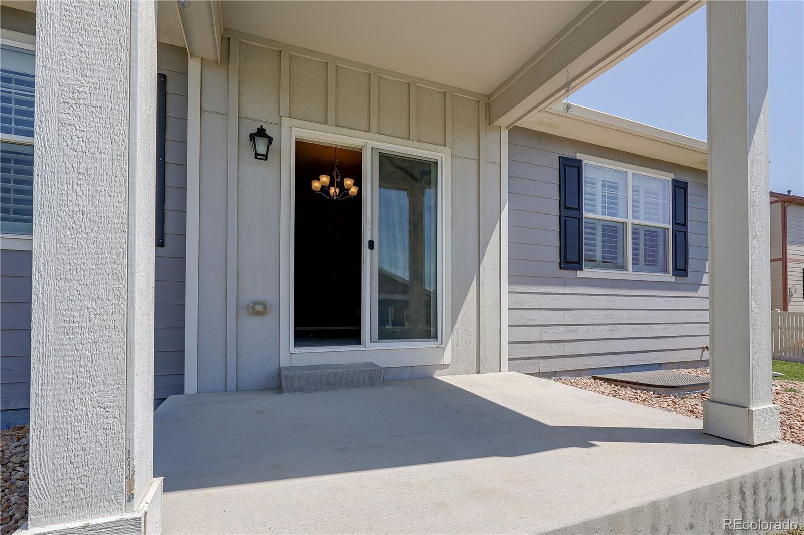 8891 Foxfire Street Firestone, CO 80504 - Photo 31 of 37 a view of a brick house with a door and a window