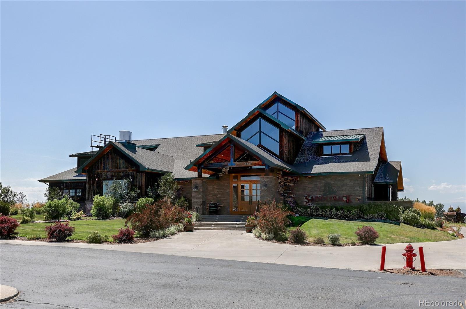 8891 Foxfire Street Firestone, CO 80504 - Photo 34 of 37 a front view of a house with a yard