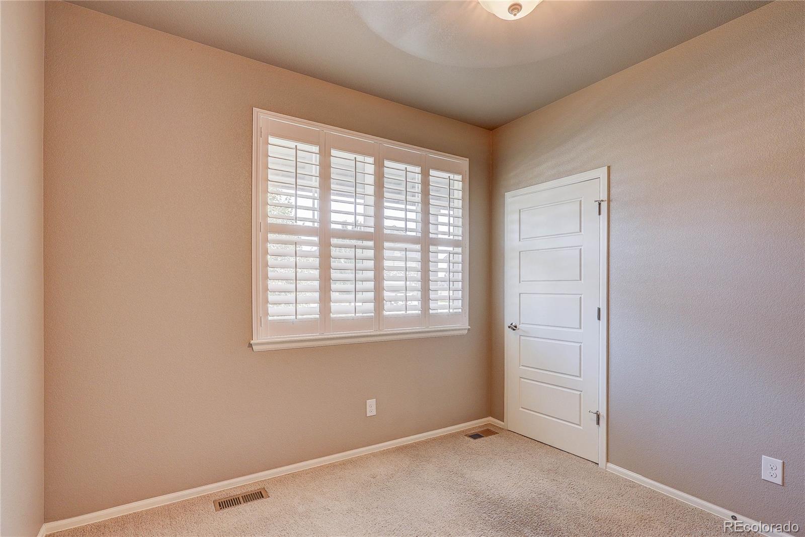 8891 Foxfire Street Firestone, CO 80504 - Photo 6 of 37 an empty room with windows
